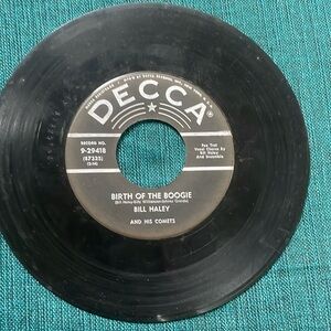 Bill Haley and His Comets.  “Birth of the Boogie” & “Mambo Rock”